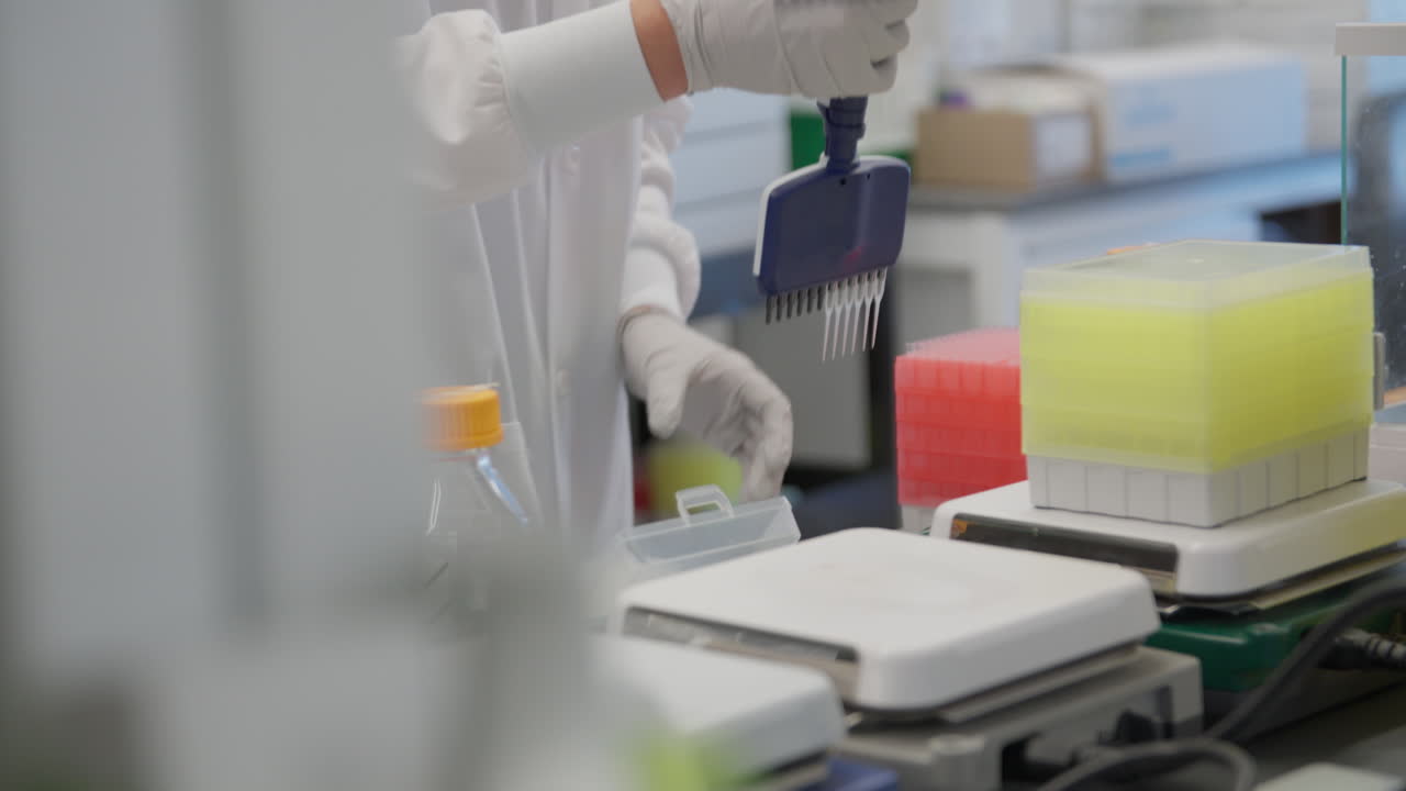Extracting samples in a lab in a close up shot