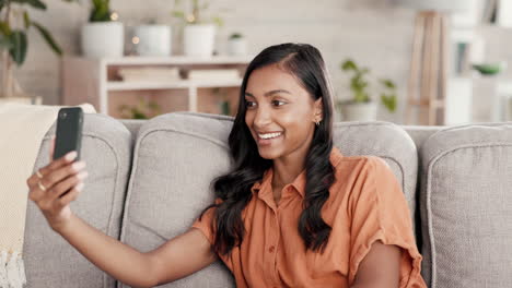 Woman,-phone-and-video-call-waving-on-living-room