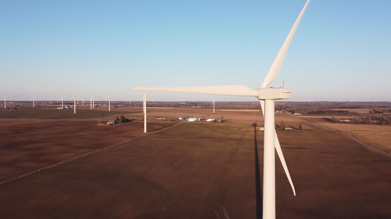 Michigan Wind Turbines  Standing Tall Over The Empty Corn Fields In Ubly, Michigan Against The Blue Sky.-medium shot