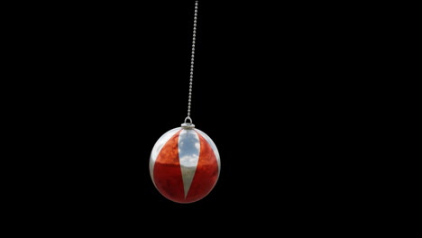 animation of christmas red bauble on black background