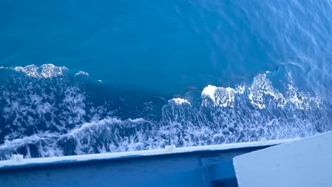 ferry shadow ship on blue sea surface