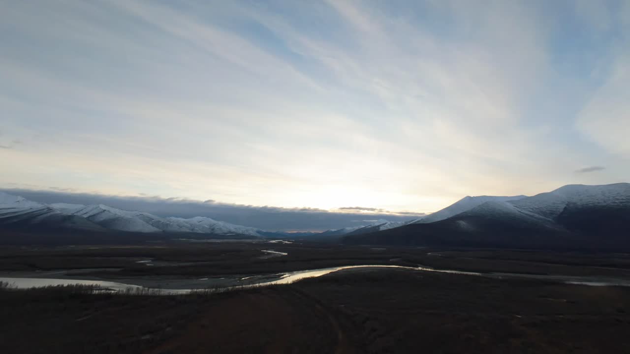 Majestic Sunset over a Snow-Covered Alaskan Valley