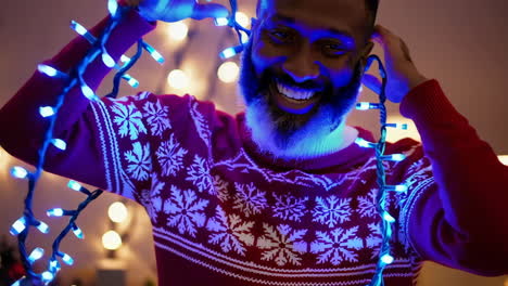 happy man enjoying christmas lights