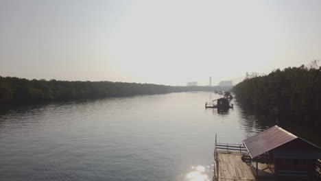 aerial drone view of bagan lalang river in foggy morning, malaysia