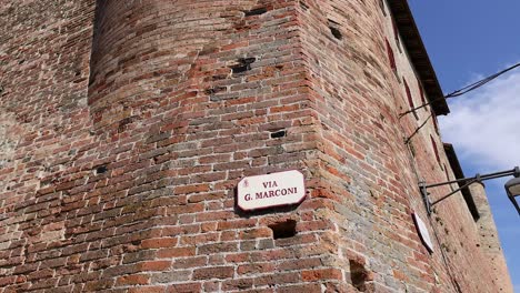 historic brick tower under a clear blue sky