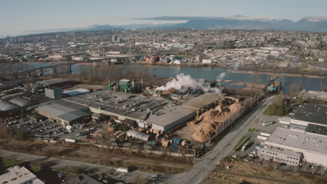 aerial flying over a wood processing facility in greater vancouver