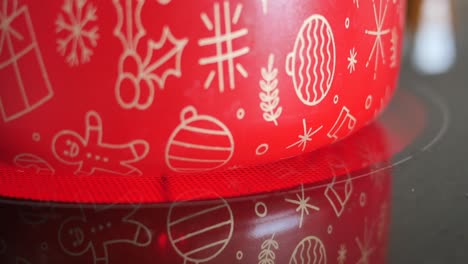 christmas-themed red pot on stovetop