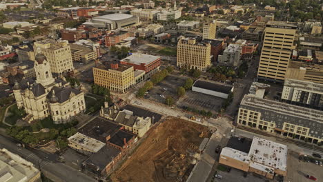 Evansville-Indiana-Aerial-v4-low-birds-eye-view-flyover-and-around-town-center-capturing-Old-Vanderburgh-County-Courthouse-and-streets-views-at-sunset---Shot-with-Mavic-3-Pro-Cine---September-2023