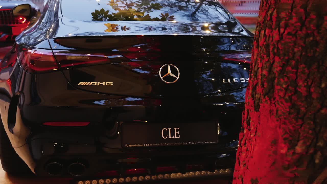 Rear view of shiny brand new car, unlock vehicle and activate lights, Czechia