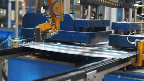 Metal-sheet-moving-on-manufacturing-line-at-factory.-Production-washing-machine