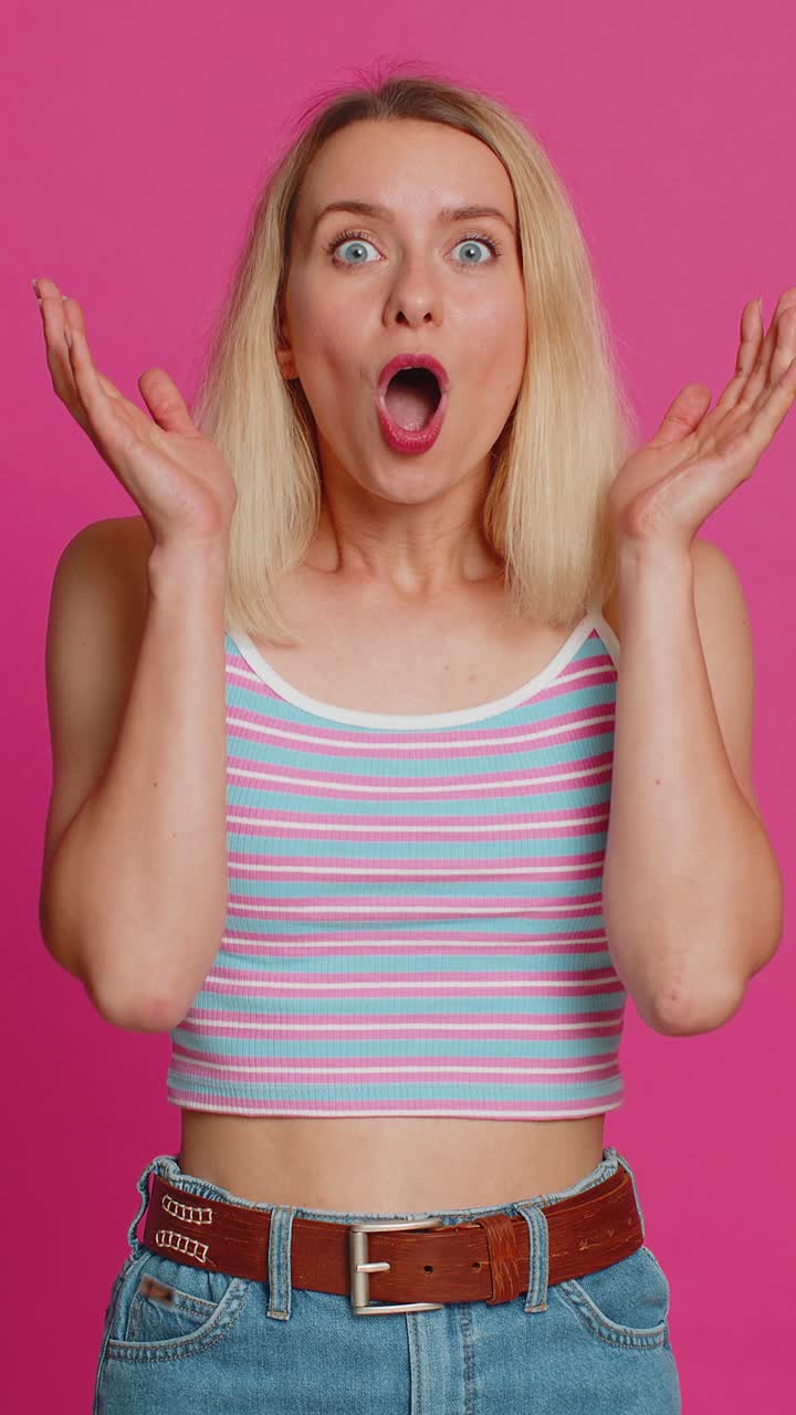 Shocked amazed woman surprise looking at camera with big eyes shocked by sudden victory wow emotion