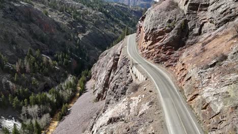 aerial view of a dangerous highway, steep drop offs, red mountain pass, million dollar highway, uncompahgre gorge