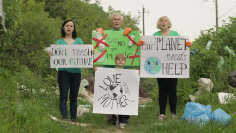 Volunteer-team-holding-encouraging-posters.-Calls-out-slogans.-Reduce-trash-cellophane-pollution