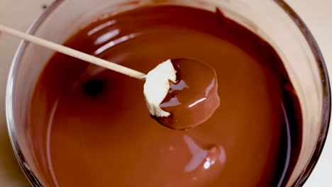 banana slice dipped in rich, melted chocolate