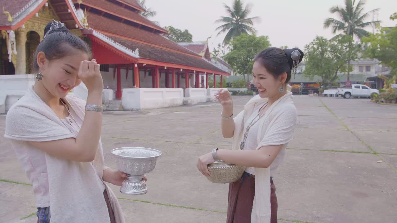 Lao Women Playing Splashing Water During With Lao Traditional Costume, Slow Motion