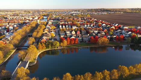 Colorful-Fall-Neighborhood-Lake-Homes-In-Suburbs-Sunset-Drone-Shot-4K