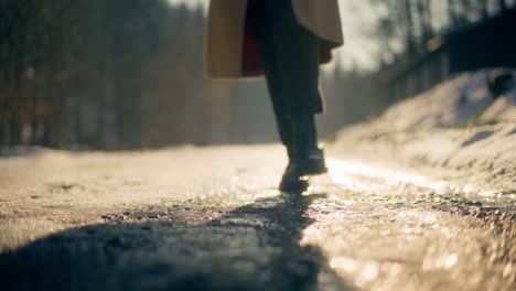 Female-Steps-Walking-On-Snow