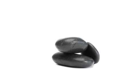 Black-pebbles-rotating-and-falling