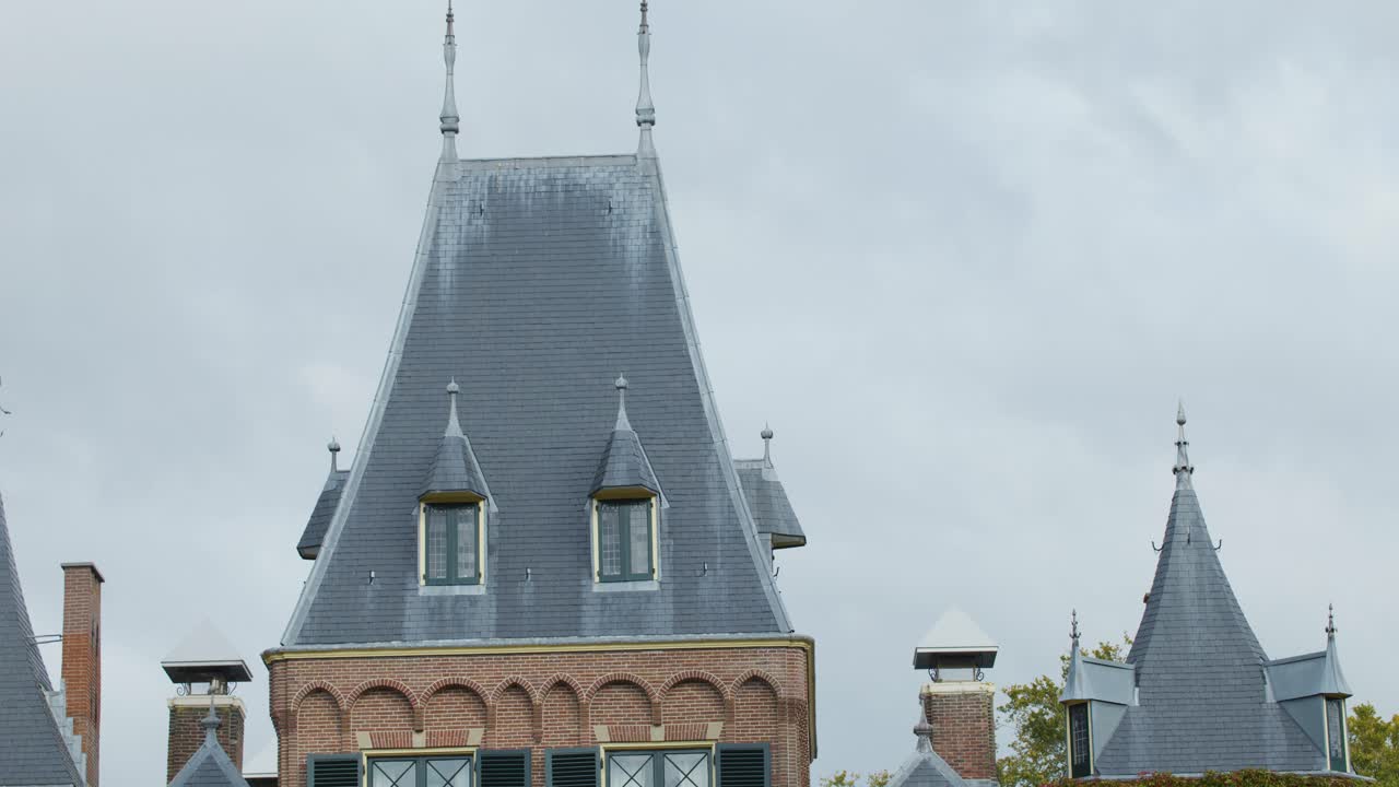 Elegant castle exterior with lush gardens, ivy, and classic architecture in springtime Netherlands