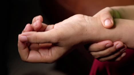 person checking wrist pulse