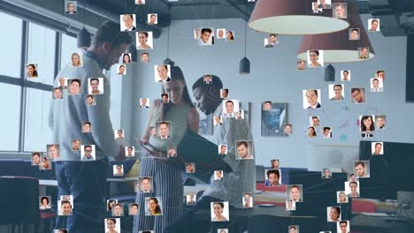 animation of network of business profile icons over diverse colleagues discussing together at office
