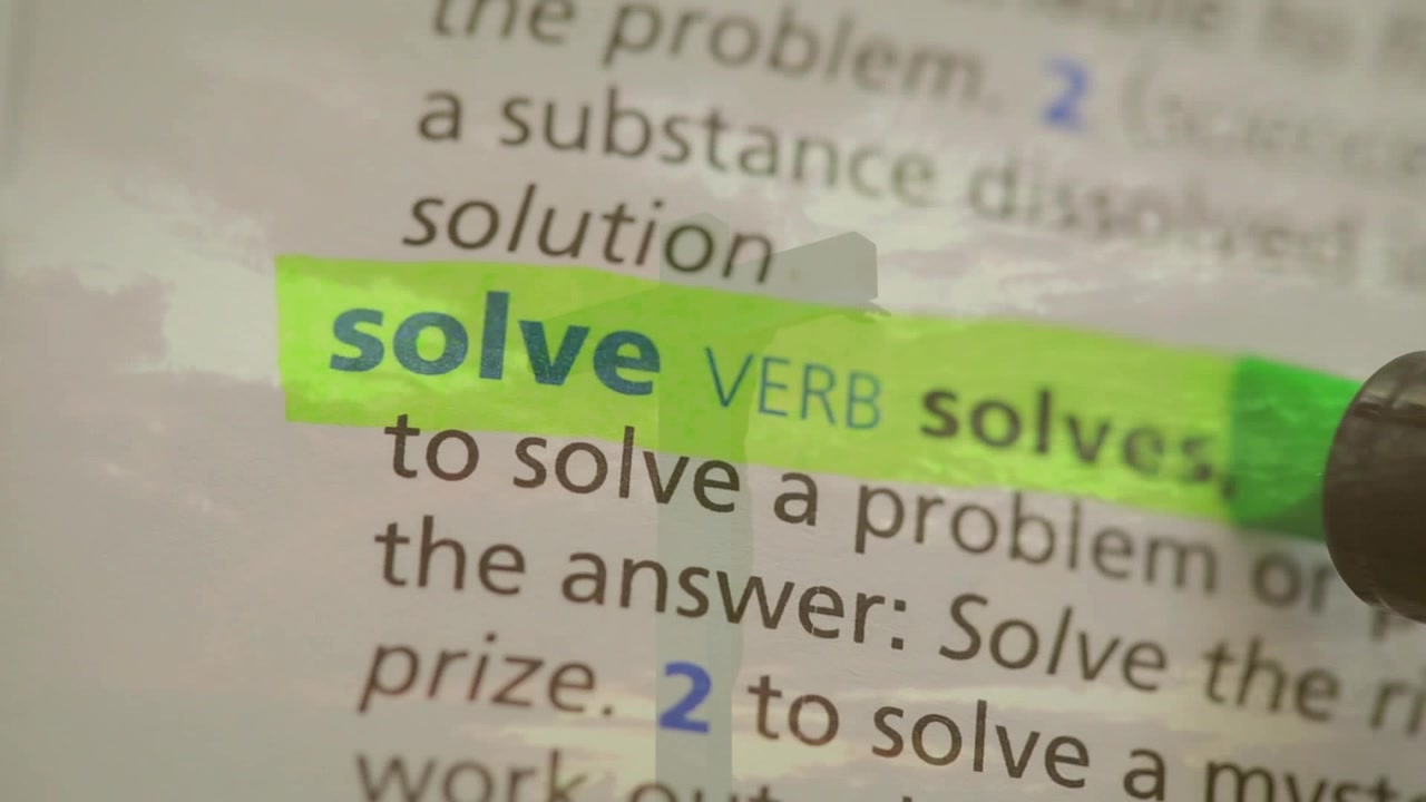 Hand holding green marker starting left gliding right laying bright strip revealing solve for study