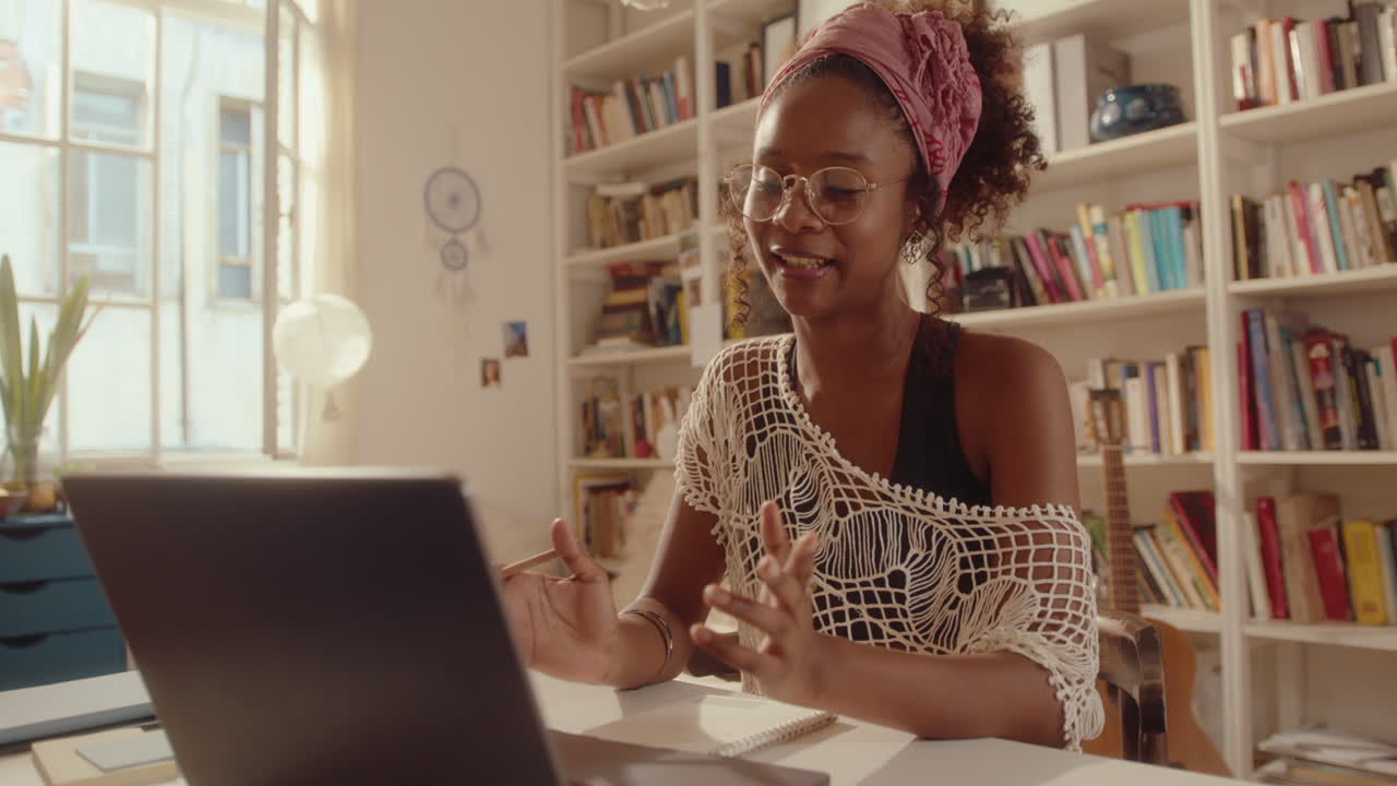 Smiling African-American Girl Chatting on Web Call at Home