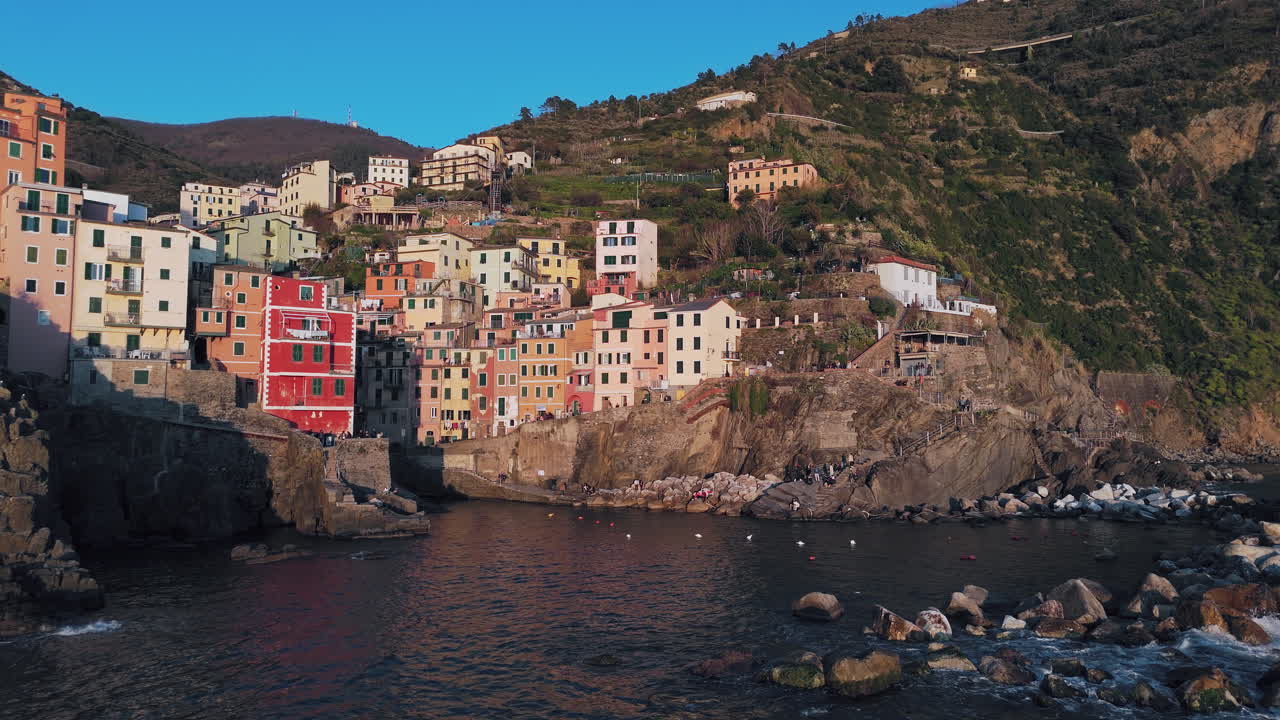 Colorful houses of Riomaggiore, Cinque Terre, along the Italian coast on a sunny day