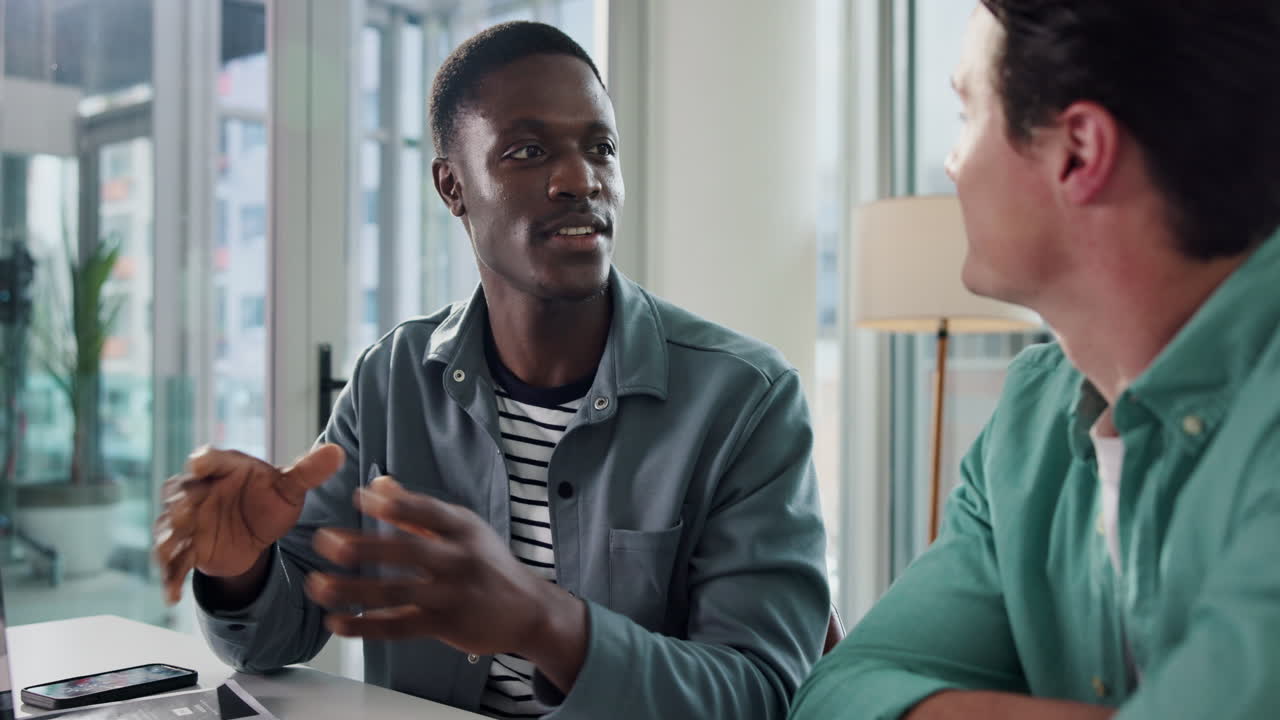Two men in an office having a meeting
