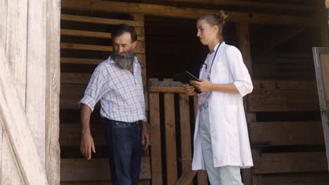 man and woman visiting the stables