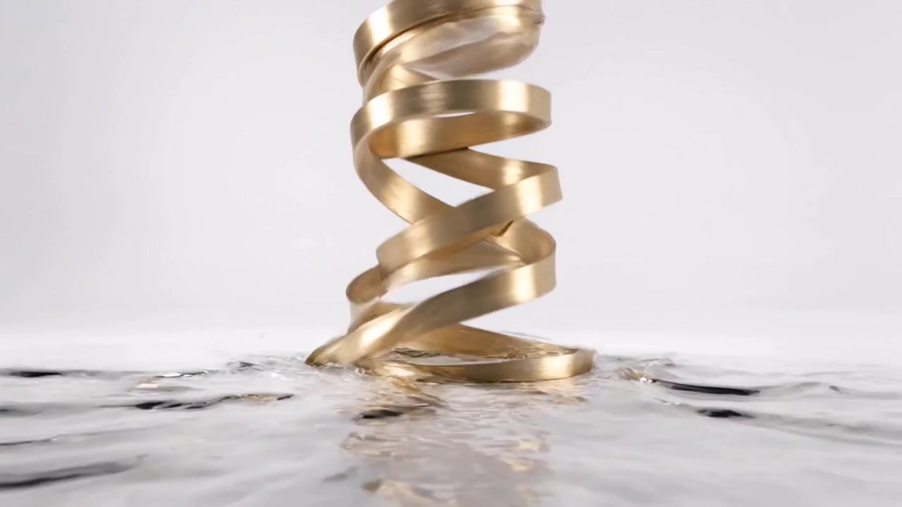 Liquid Metal Transforming into a Golden Spiral Shape