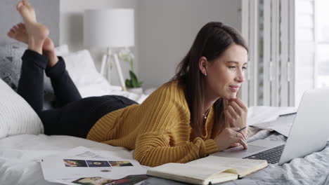 a young woman using a laptop