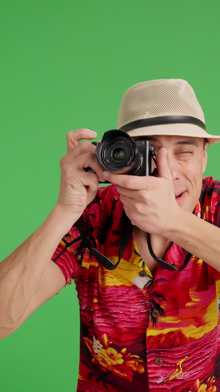 Impressed tourist taking photos and enjoying sightseeing on green screen