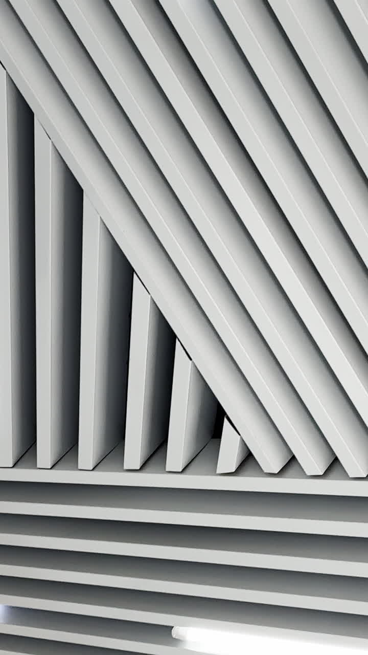 Black and white image of led lamps working on the embossed ceiling. Low angle perspective. Vertical video