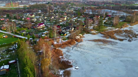 frozen lake and lakeside village in winter in sweden