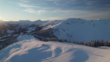 ski area with skiers in saalbach-hinterglemm, austria during winter - aerial shot