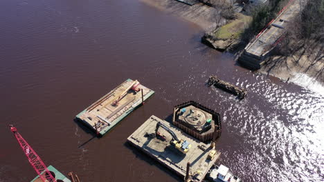 an aerial shot over a construction site in a creek