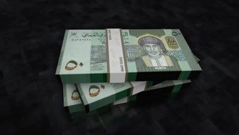 el dinero de omán se acumula en pilas de billetes. animación.