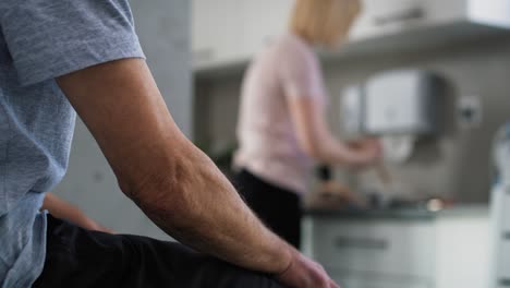 Close-up-of-senior-man-waiting-for-specialist-at-doctor's-office.