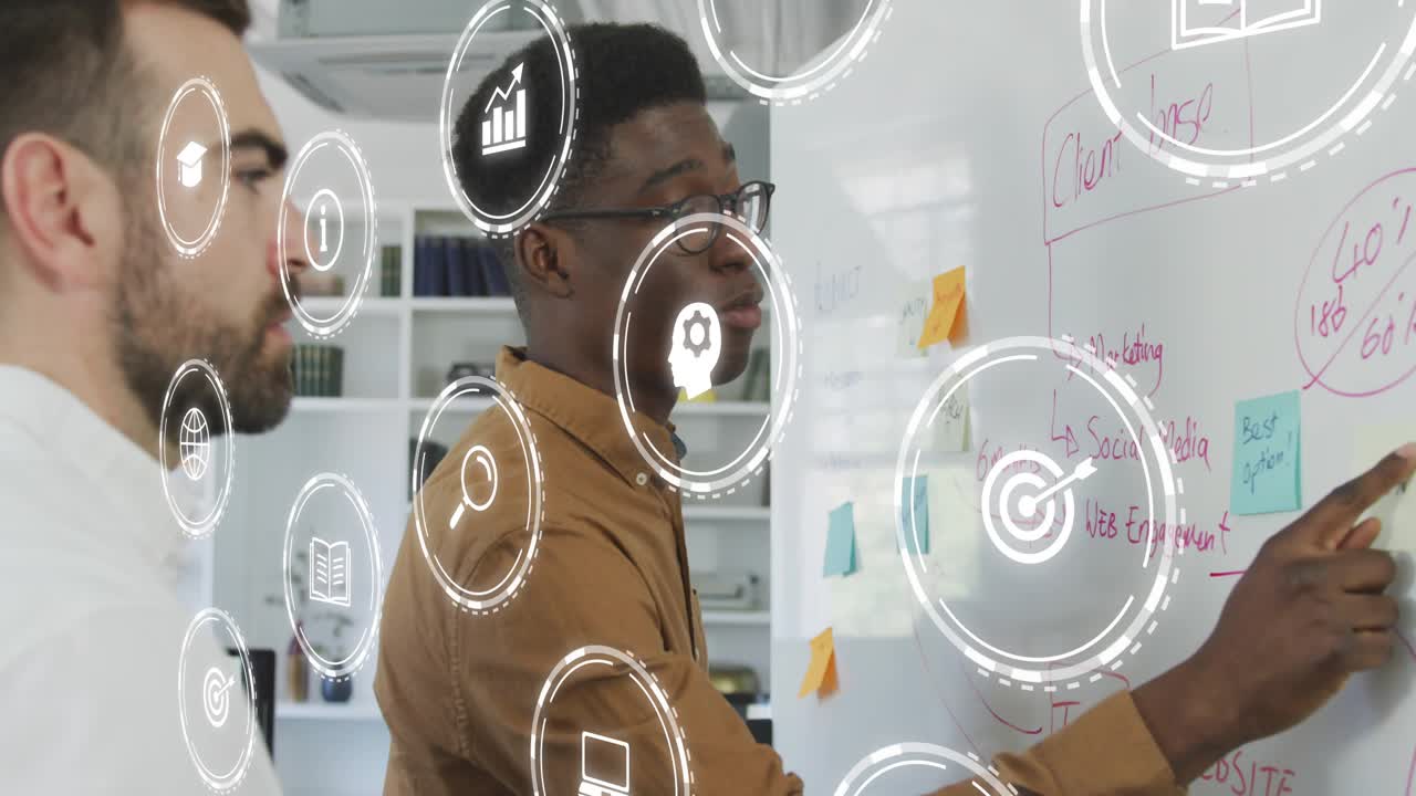 Two men writing marketing chart on whiteboard, icons appearing enhancing strategy planning