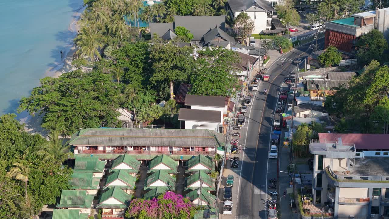 Drone perspective of White Sand Beach Resort swimming pool, Koh Chang. Sunny morning aerials of Thailand's coastal beauty on the island of Koh Chang