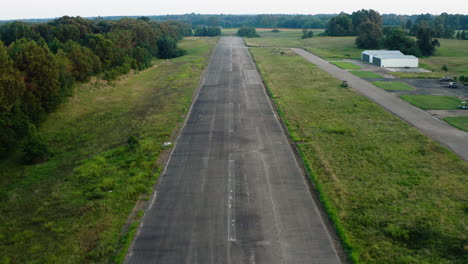 decommissioned airport landing and takeoff airstrip in wynne arkansas, drone descends