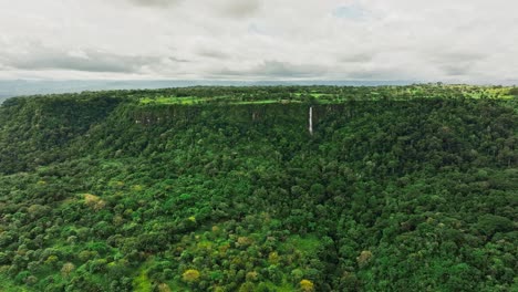 drone shot of a plateau with a big waterfall