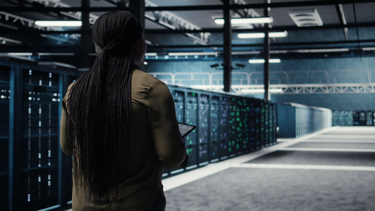 High tech data center technician uses tablet to develop disaster recovery plans