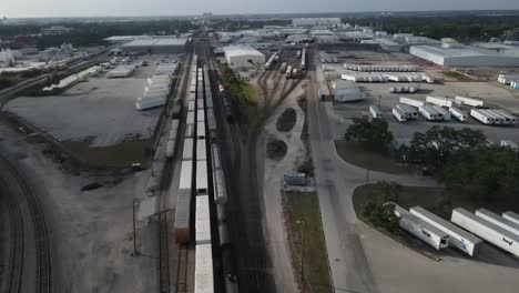 Aerial-view-of-rail-road-tracks-and-trailers-in-abandoned-yard-in-florida