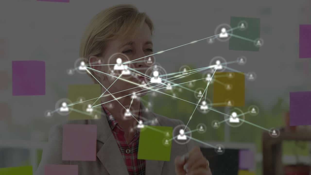 Business manager affixing colored sticky notes on glass wall and initiating animated network growth
