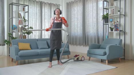 woman dancing while vacuuming