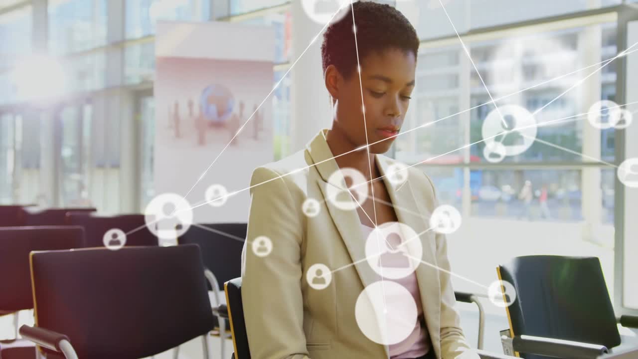 female professional sitting in business conference seats, viewing network user-icons overlay