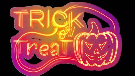 Animation-of-trick-or-treat-text-at-halloween-over-pumpkin