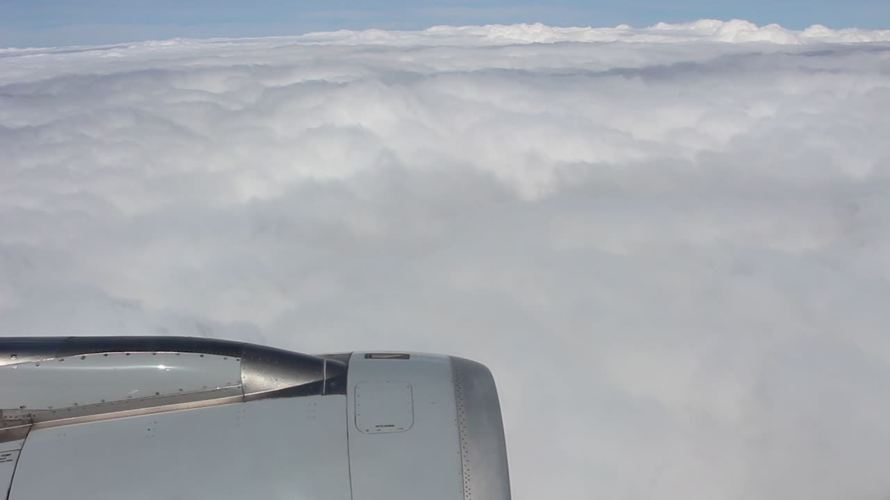 flight above the clouds, visible engine